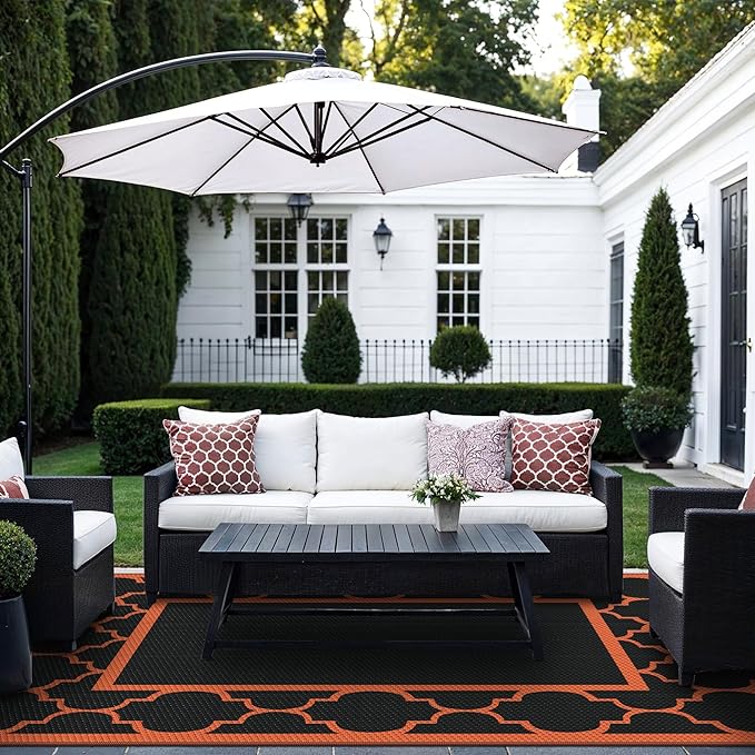 GENIMO 6' x 9' Outdoor Rug Waterproof for Patio Decor, Foldable Reversible Plastic Straw Area Rugs Mat for Camper, Outside Carpet for Rv, Deck, Porch, Picnic, Beach, Balcony, Black & Orange