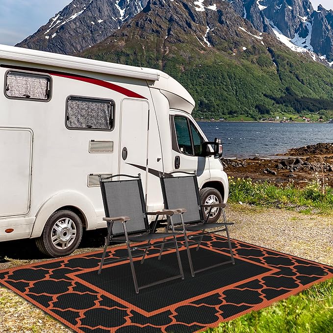 GENIMO 6' x 9' Outdoor Rug Waterproof for Patio Decor, Foldable Reversible Plastic Straw Area Rugs Mat for Camper, Outside Carpet for Rv, Deck, Porch, Picnic, Beach, Balcony, Black & Orange
